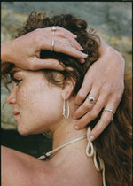 model wearing sterling silver ring with garnet gemstone