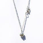 sphere pendant on silver chain