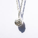 sphere pendant on silver chain
