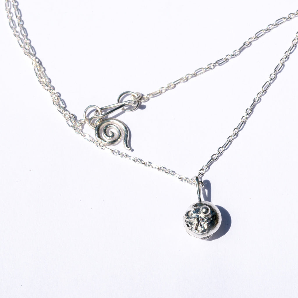 sphere pendant on silver chain
