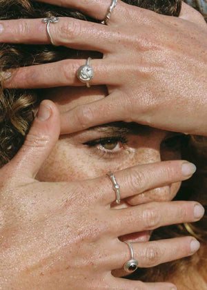 model wearing silver rings