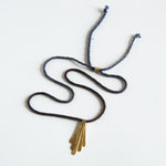 Purple silk rope necklace with brass pendants