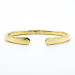 brass hand forged heavy gauge cuff on white background