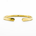 brass hand forged heavy gauge cuff on white background