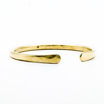 brass hand forged heavy gauge cuff on white background