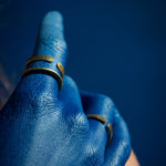model wearing brass ring with flattened ends