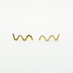 wavy stud earrings on white background