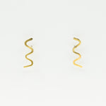 wavy stud earrings on white background