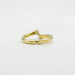 back view of hand forged curved brass ring on white background