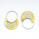 brass sheet earrings with silver hoops on white background
