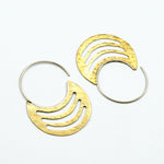 brass sheet earrings with silver hoops on white background