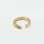 top view of hand forged brass ring with three notches