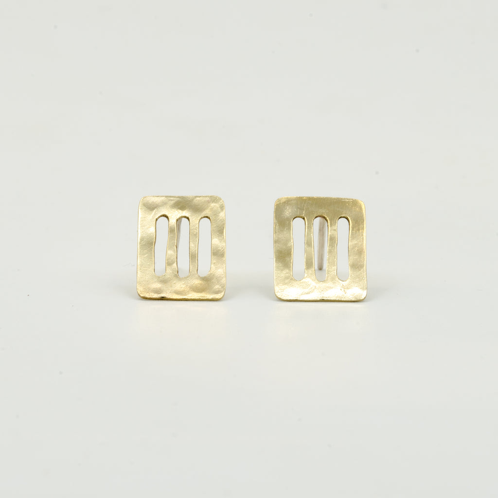 cutout brass sheet stud earrings on white background