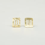 cutout brass sheet stud earrings on white background