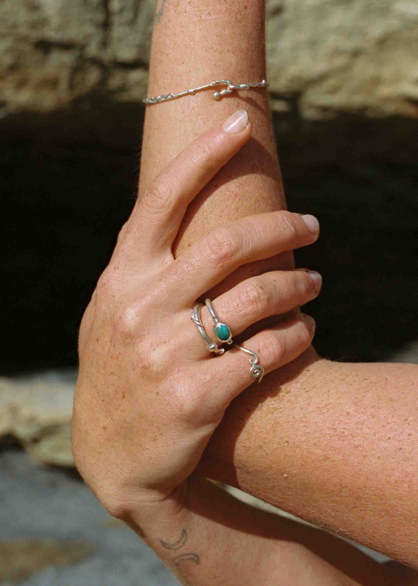 model wearing silver rings