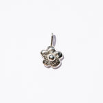 Silver flower-shaped pendant on a white background