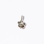 Silver flower-shaped pendant on a white background
