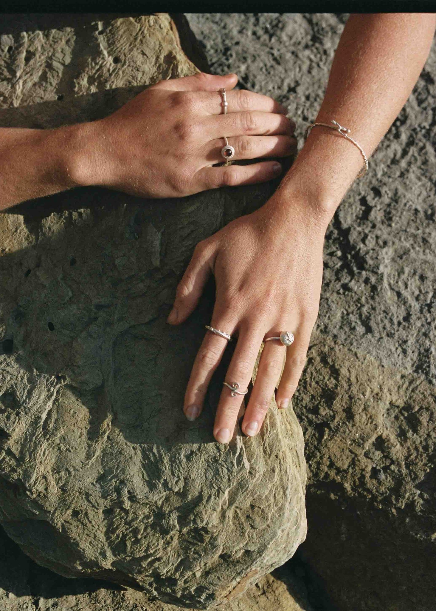 model wearing silver jewelry