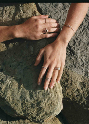 model wearing silver jewelry