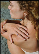 model wearing silver jewelry