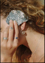 model wearing silver jewelry