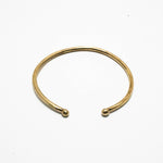 Brass cuff with balled ends