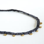 Purple silk braid necklace with seven circle pendants close up