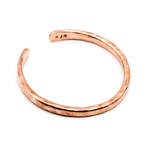 copper hand forged heavy gauge cuff on white background