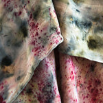 close up silk hand dyed scarf watercolour like blue patterns with pink specks