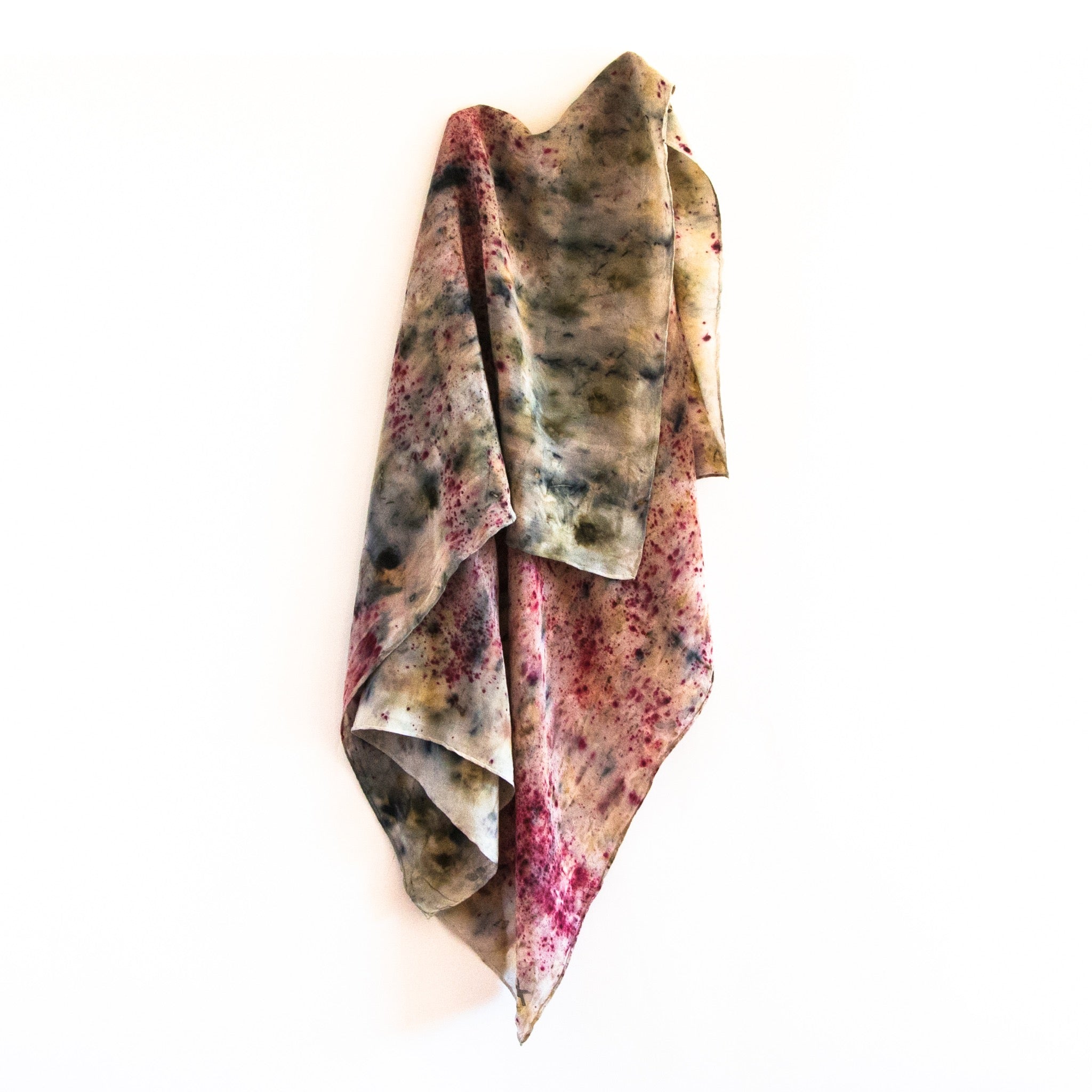 front view of hanging silk scarf with an eco dye pattern