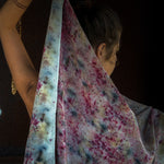 Model holding eco dyed silk scarf