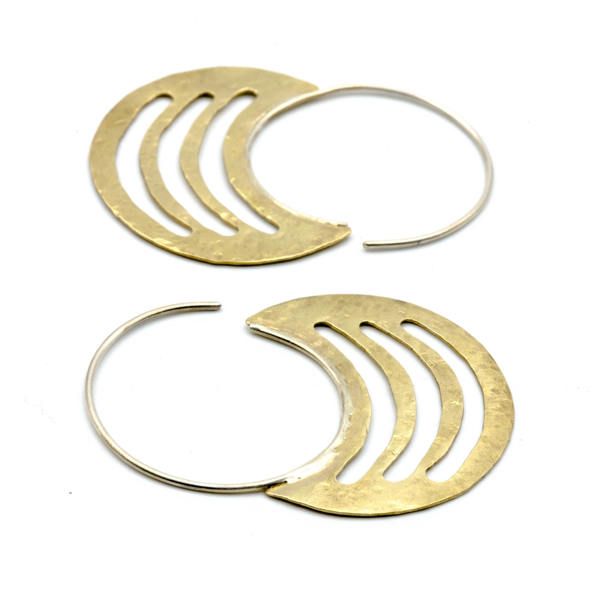 brass sheet earrings with silver hoops on white background