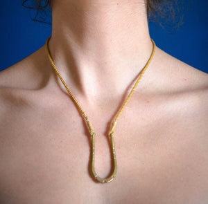 Model using U shaped pendant necklace