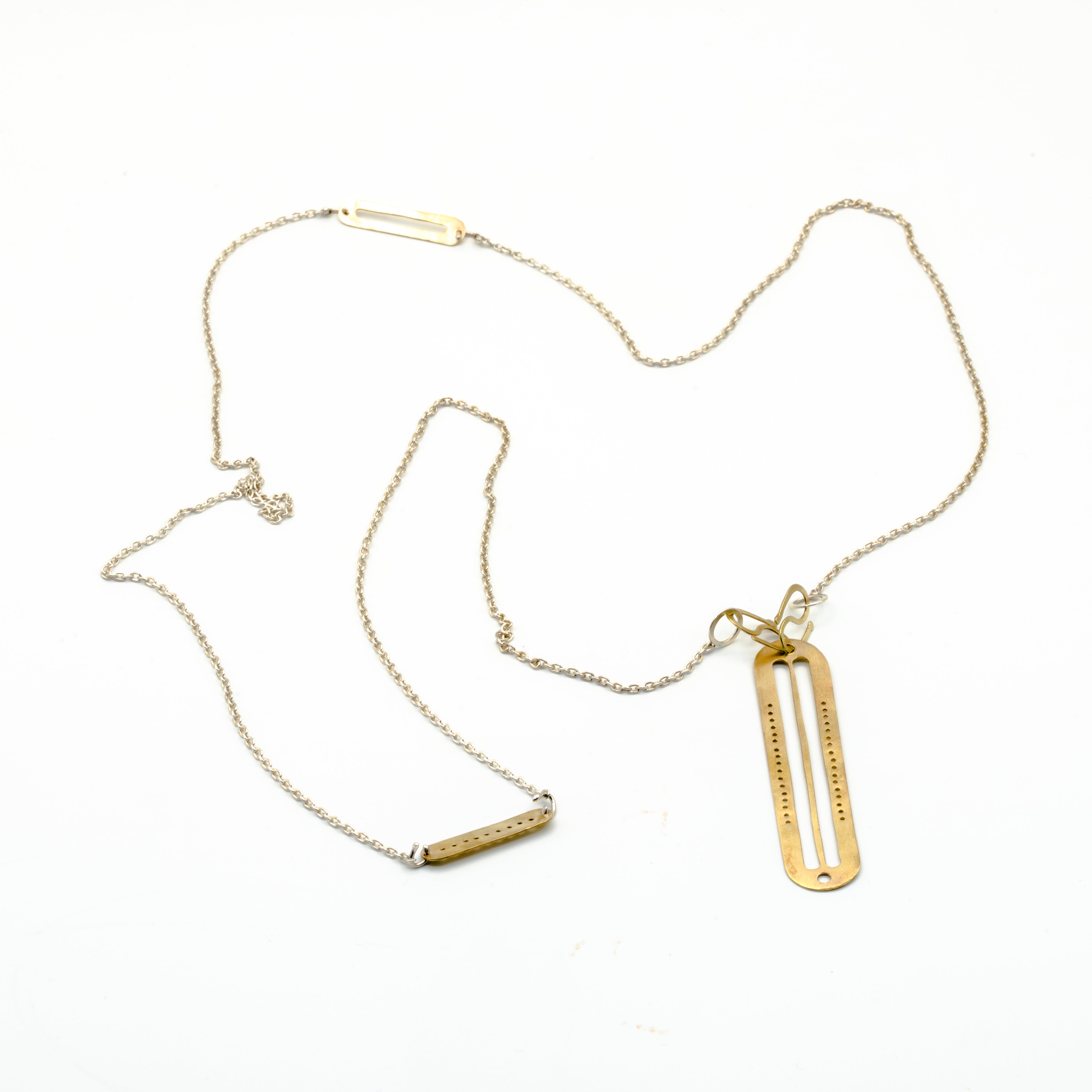 top view of brass cutout pendant necklace