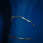 Model using delicate brass and silver bracelet