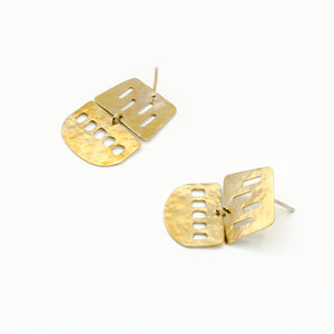 cutout brass sheet dangle earrings on white background 