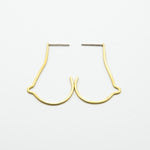 breast shaped brass wire earrings on white background close together